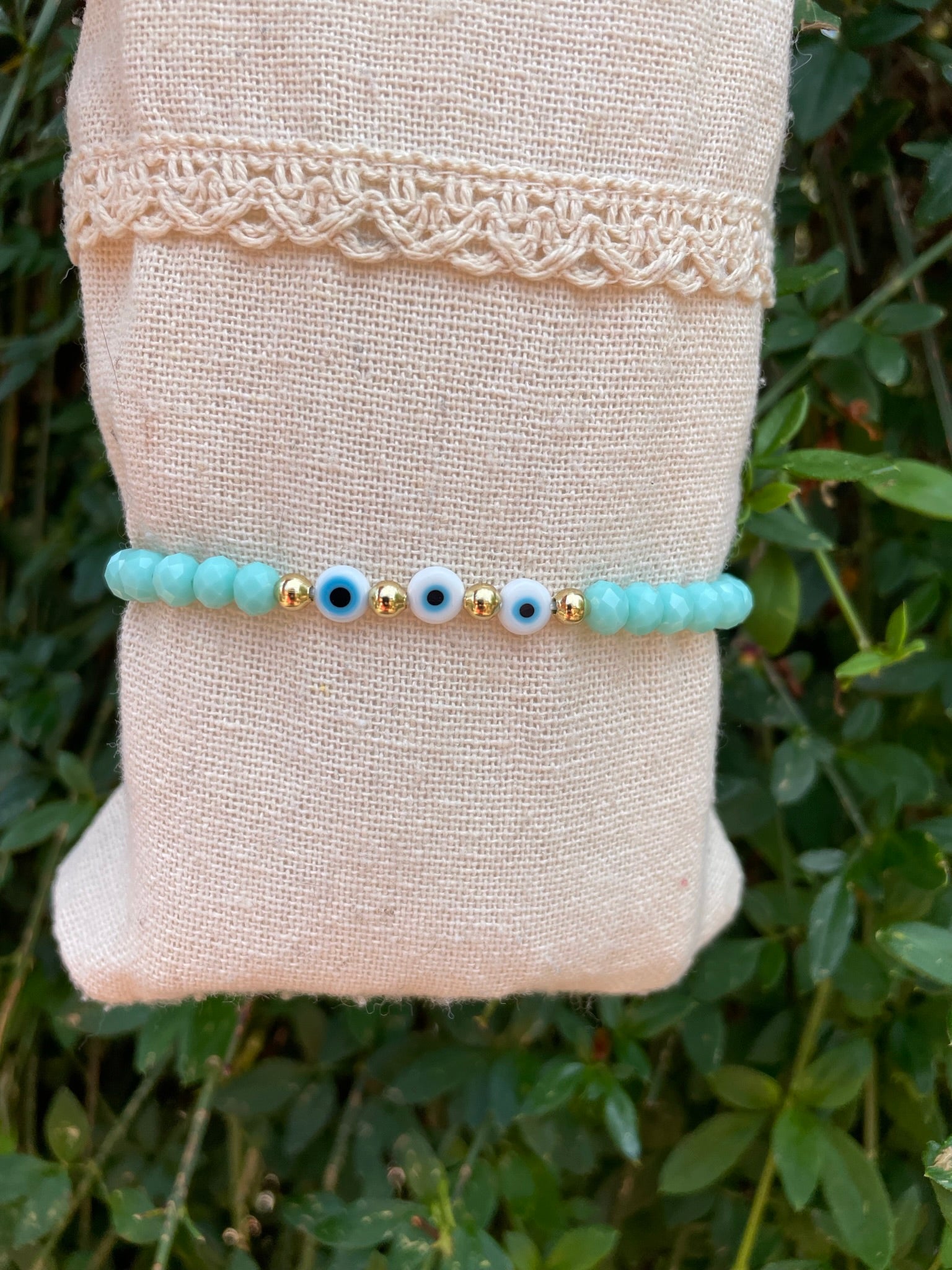 Bracelet élastique en perles de verre à facettes forme Oblate et Oeil Nazar Boncuk