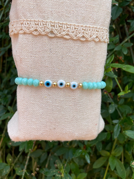 Bracelet élastique en perles de verre à facettes forme Oblate et Oeil Nazar Boncuk